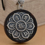 Buddhistischer Anhänger aus 925er Sterlingsilber und Sandelholz